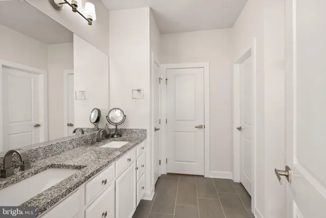 a bed room with a bed and a window