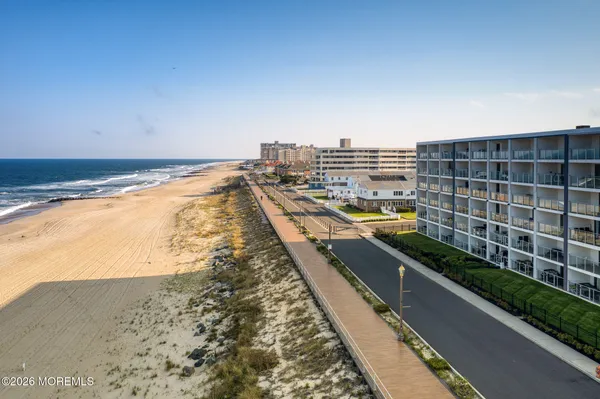 a view of a patio with table and chairs