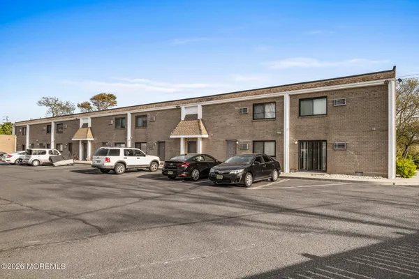 a view of a car in front of a building
