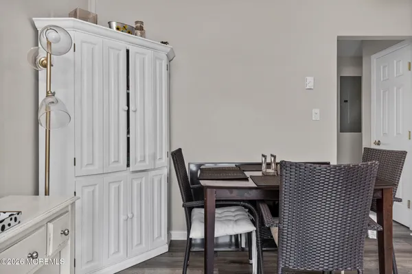 a front view of a house with garden and plants