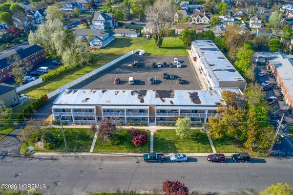 a view of a lake with beach and city view