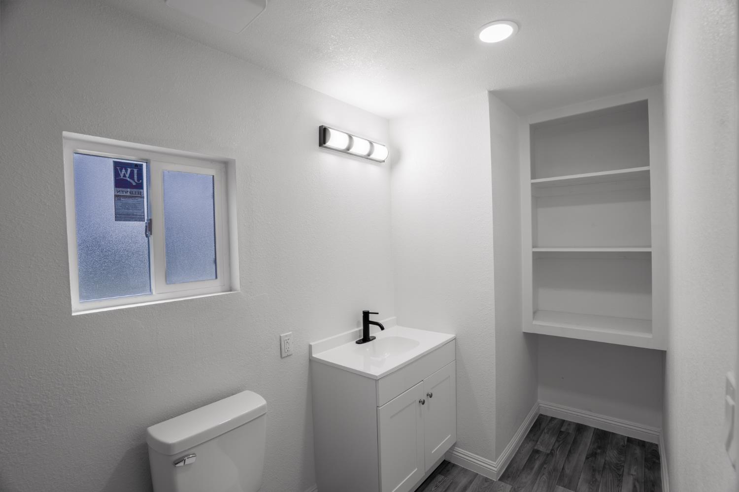 36712 Pebble Lane Squaw Valley, CA 93675 - Photo 12 of 17 a white house with sink and mirror