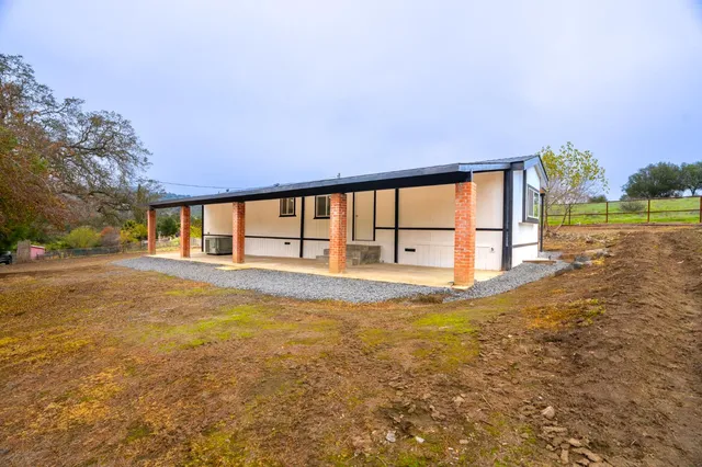 a view of water pool and trees in the background