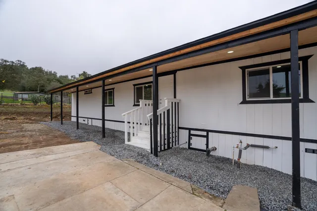 a house view with a backyard space