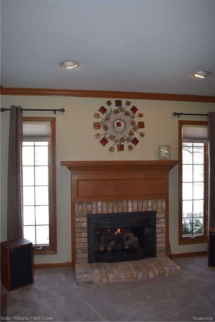 1993 Ridgefield Court Rochester, MI 48306 - Photo 9 of 47 THERE IS A GAS FIREPLACE IN THE LARGE LIBRARY/STUDY (11 X 15). CHECK OUT THE "FLOOR TO CEILING" WINDOWS LOCATED ON EACH SIDE OF THE GAS FIREPLACE.
