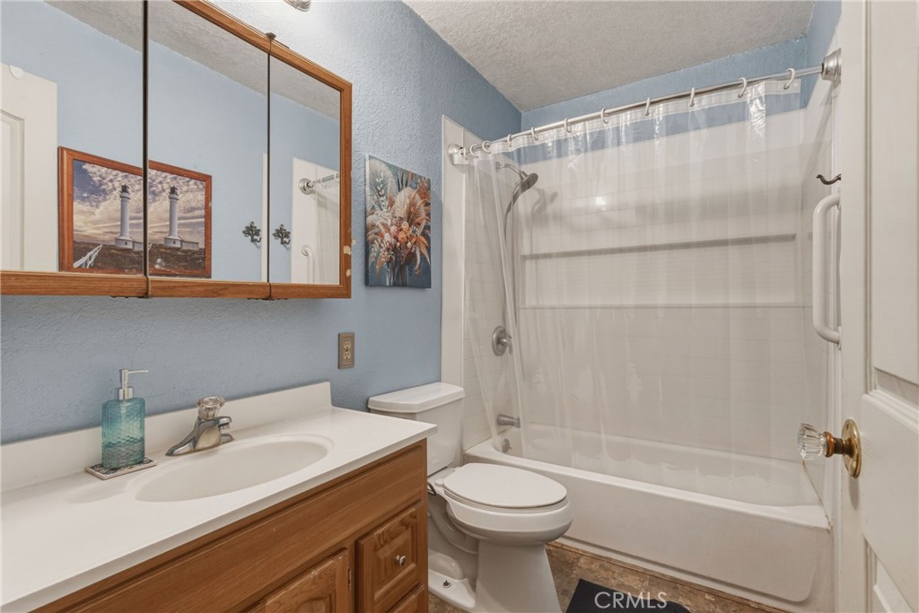 6812 Helton Street Winton, CA 95388 - Photo 15 of 24 a bathroom with a sink toilet and shower