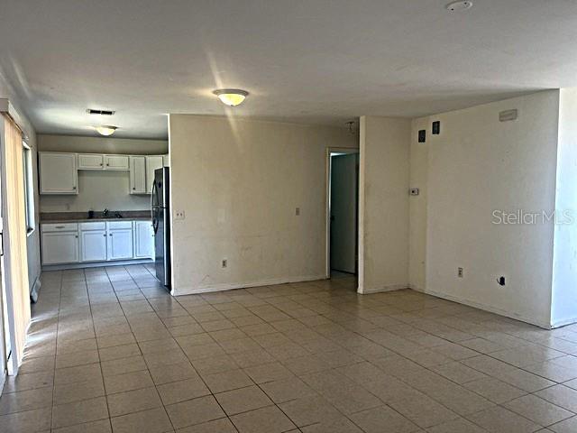 12 Pine Course Way Ocala, FL 34472 - Photo 6 of 29 a view of a kitchen with a sink and a refrigerator