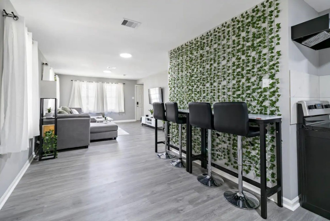 5130 Cosby Street Houston, TX 77021 - Photo 5 of 15 a living room with furniture and a flat screen tv