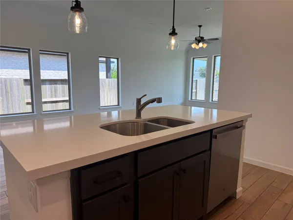 a kitchen with sink and window