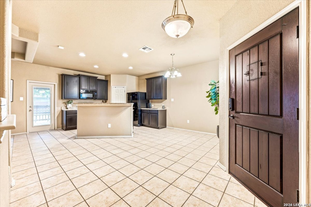3831 Bacall Way Converse, TX 78109 - Photo 6 of 33 a view of a kitchen with furniture and a window