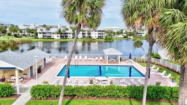 a front view of a house with outdoor space and lake view