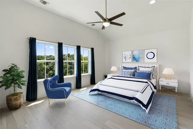 a bed room with a bed and a large window