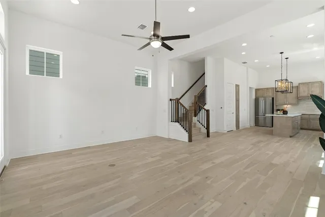 a view of a livingroom with stairs and furniture