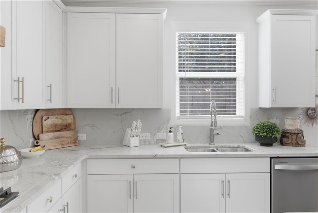 9872 Ashton Old Road Douglasville, GA 30135 - Photo 20 of 62 a kitchen with stainless steel appliances white cabinets a window and a sink