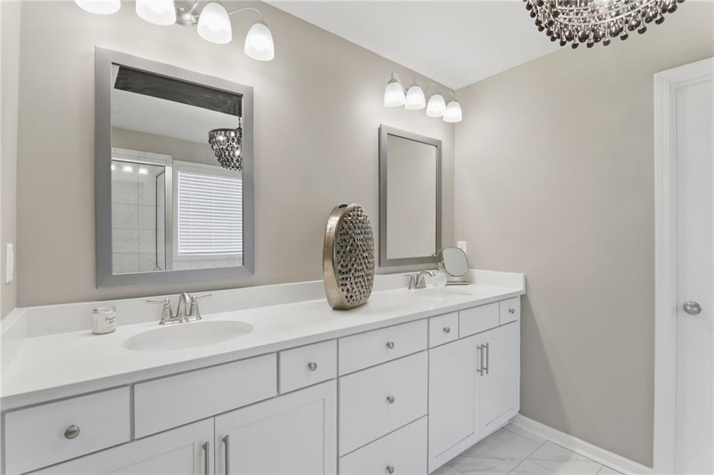 9872 Ashton Old Road Douglasville, GA 30135 - Photo 28 of 62 a bathroom with double sink and a mirror