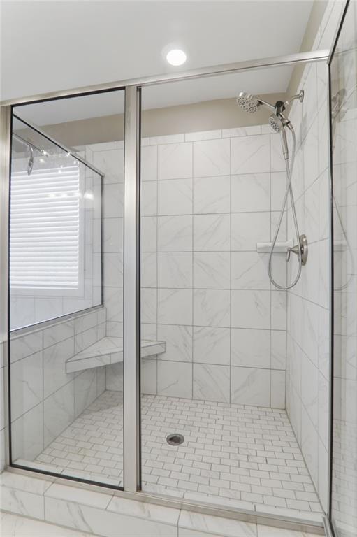 9872 Ashton Old Road Douglasville, GA 30135 - Photo 33 of 62 a bathroom with a glass shower door