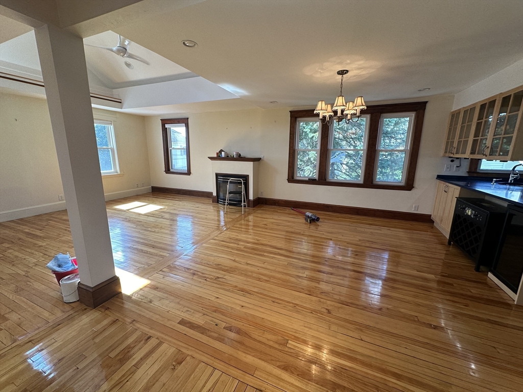 17 Herbert Road, Unit 1 Arlington, MA 02474 - Photo 10 of 26 a view of livingroom with hardwood floor and a ceiling fan