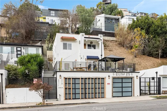 a view of a white building among the street
