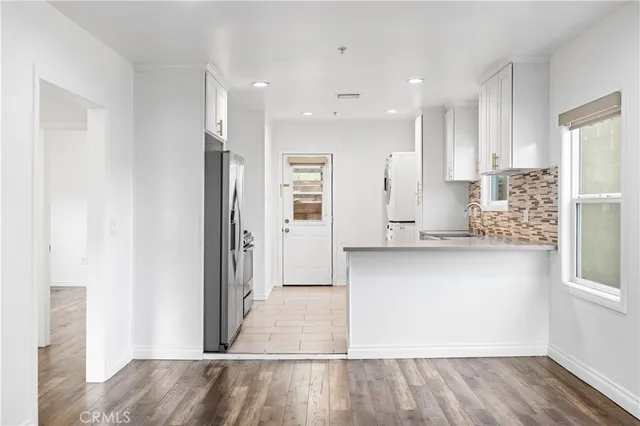 a view of kitchen with wooden floor