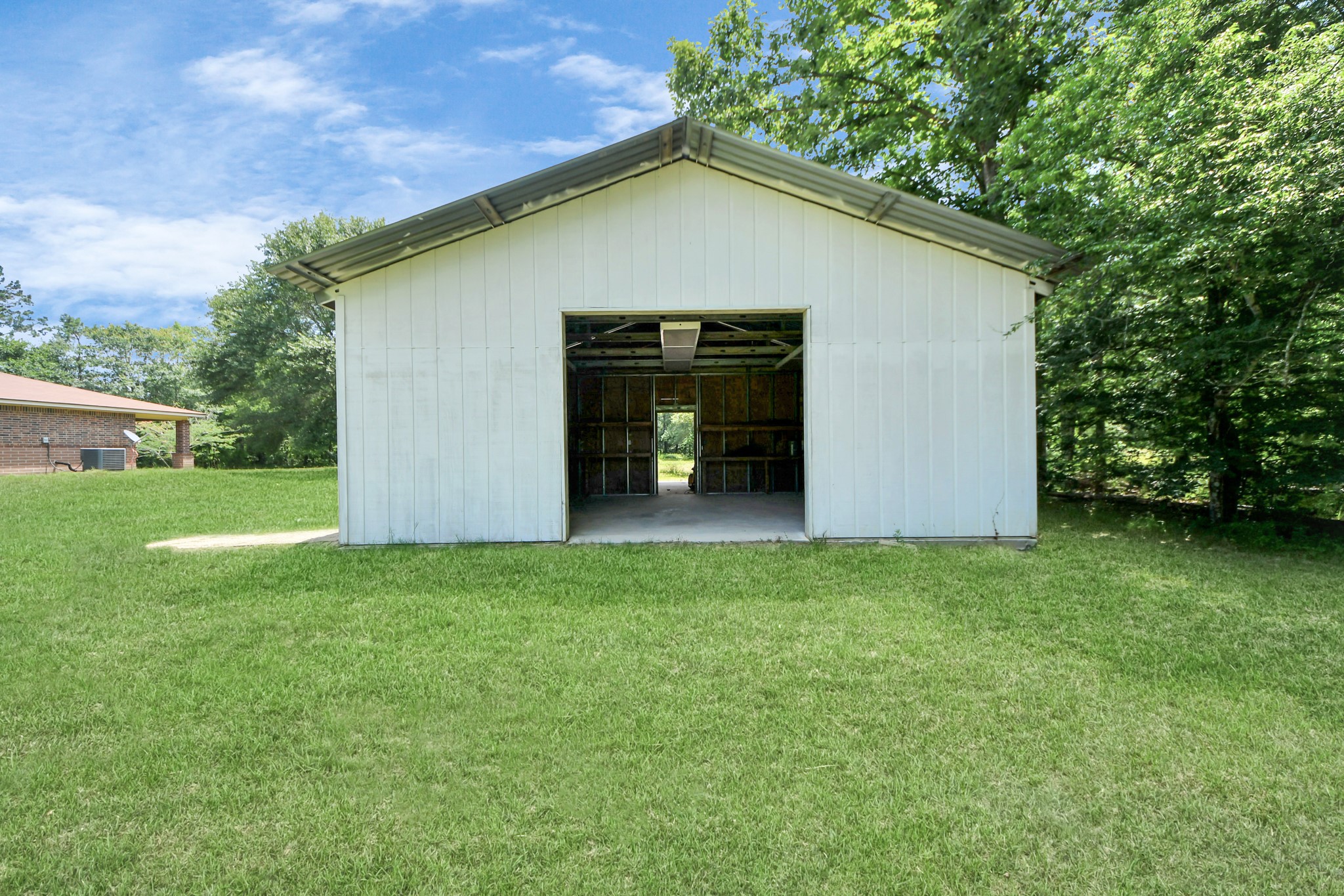 197 County Road 348 Cleveland, TX 77327 - Photo 42 of 48 Barn exterior