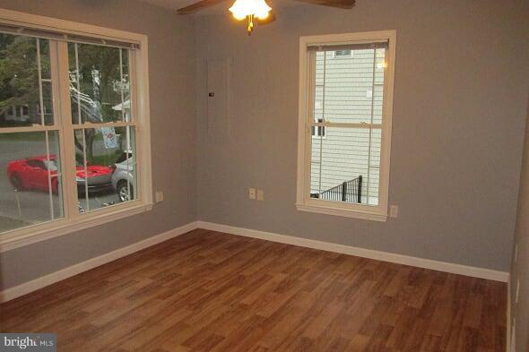 7102 Greenbank Road Baltimore, MD 21220 - Photo 18 of 30 an empty room with wooden floor and windows