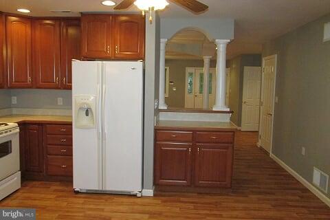 7102 Greenbank Road Baltimore, MD 21220 - Photo 10 of 30 a kitchen with stainless steel appliances granite countertop a refrigerator and a stove top oven