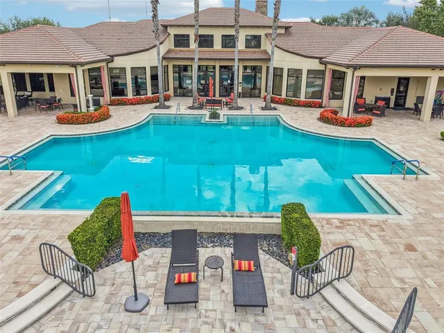 a front view of a house with garden and patio