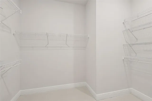 an empty room with closet area