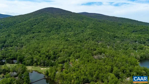 an aerial view of a house with a lake view