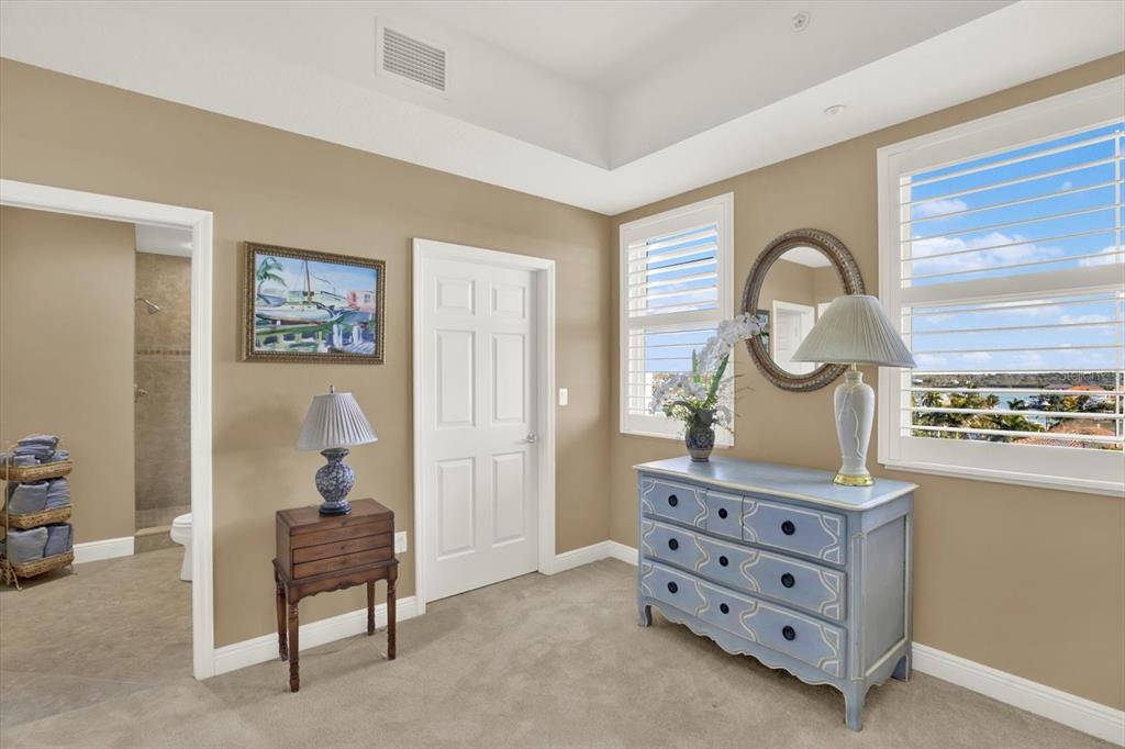 17745 Gulf Boulevard, Unit 604 Redington Shores, FL 33708 - Photo 24 of 44 a room with furniture and paintings on the wall