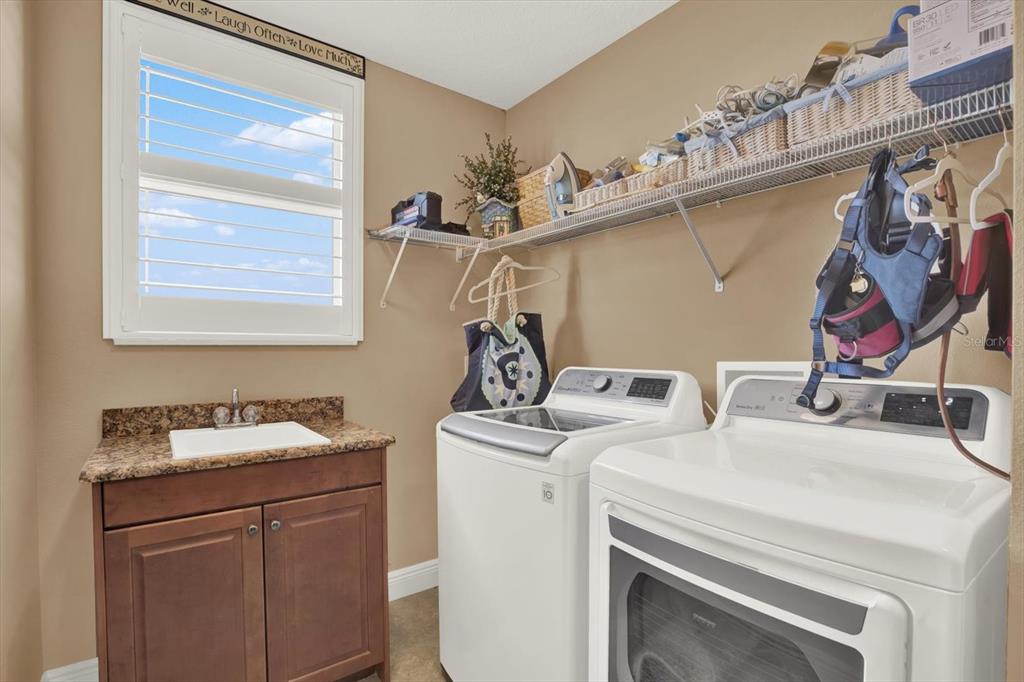 17745 Gulf Boulevard, Unit 604 Redington Shores, FL 33708 - Photo 26 of 44 a utility room with dryer and washer
