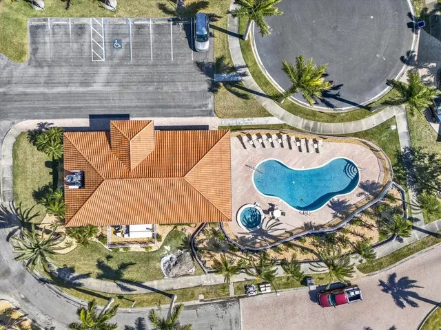 an aerial view of a house with a swimming pool