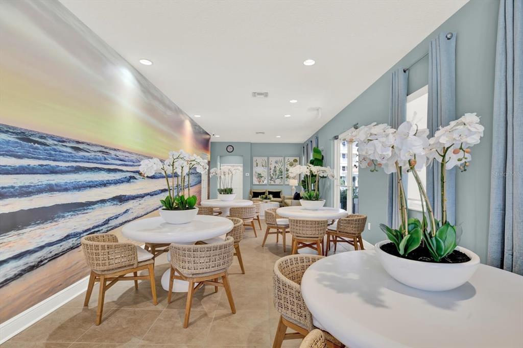 17745 Gulf Boulevard, Unit 604 Redington Shores, FL 33708 - Photo 34 of 44 a view of a dining room with furniture and a potted plant