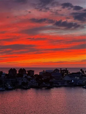 a view of lake with sunset
