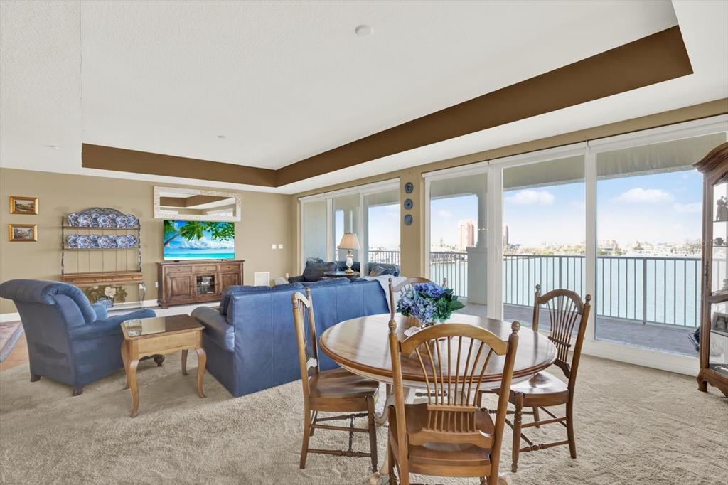 17745 Gulf Boulevard, Unit 604 Redington Shores, FL 33708 - Photo 5 of 44 a view of a dining room with furniture a rug and a large window