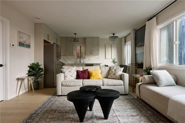 a living room with furniture and a large window