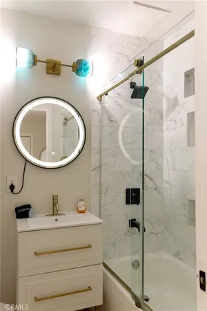 a bathroom with a sink and a mirror