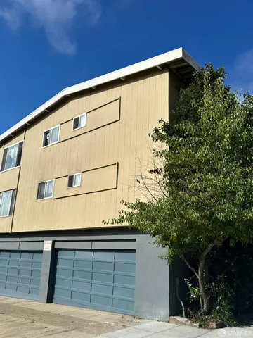 a front view of a house with a garage
