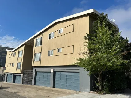 a view of a house with a tree