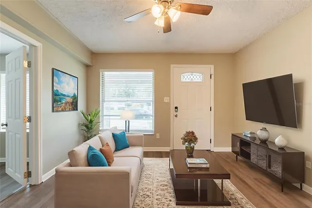 a living room with furniture and a flat screen tv
