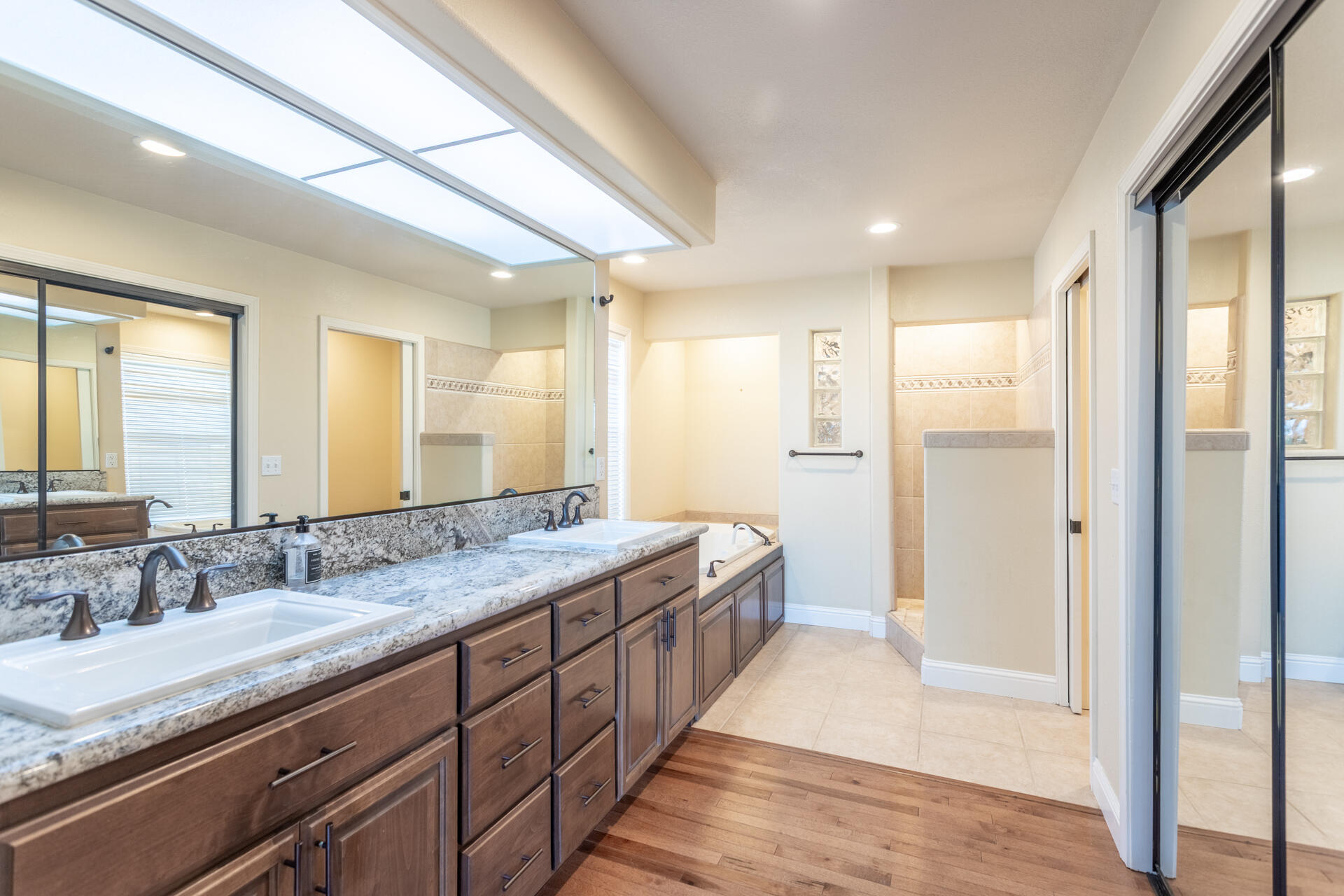 3126 Riesling Path Redding, CA 96001 - Photo 14 of 32 a spacious bathroom with a granite countertop sink mirror and double