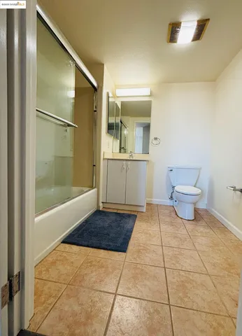 a bathroom with a shower and a toilet