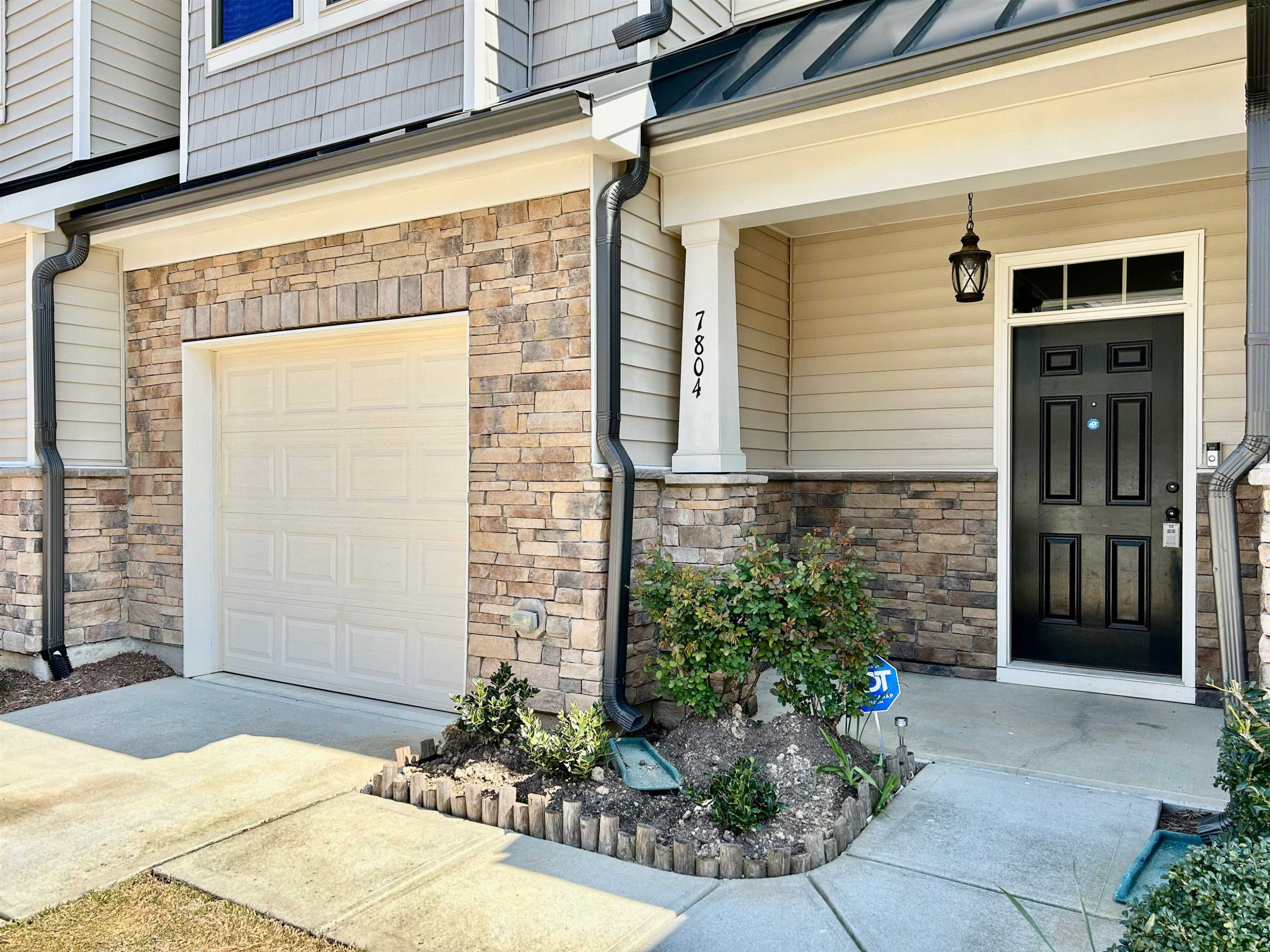 7804 Elmshire Way Raleigh, NC 27616 - Photo 2 of 41 a front view of a house with a yard