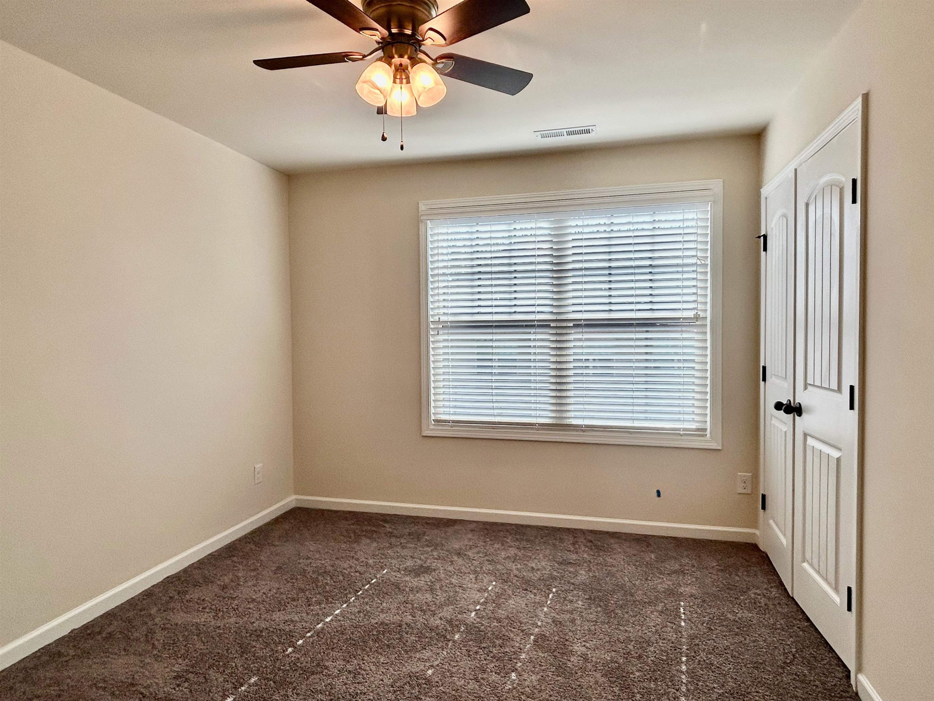 7804 Elmshire Way Raleigh, NC 27616 - Photo 21 of 41 a view of an empty room with a window