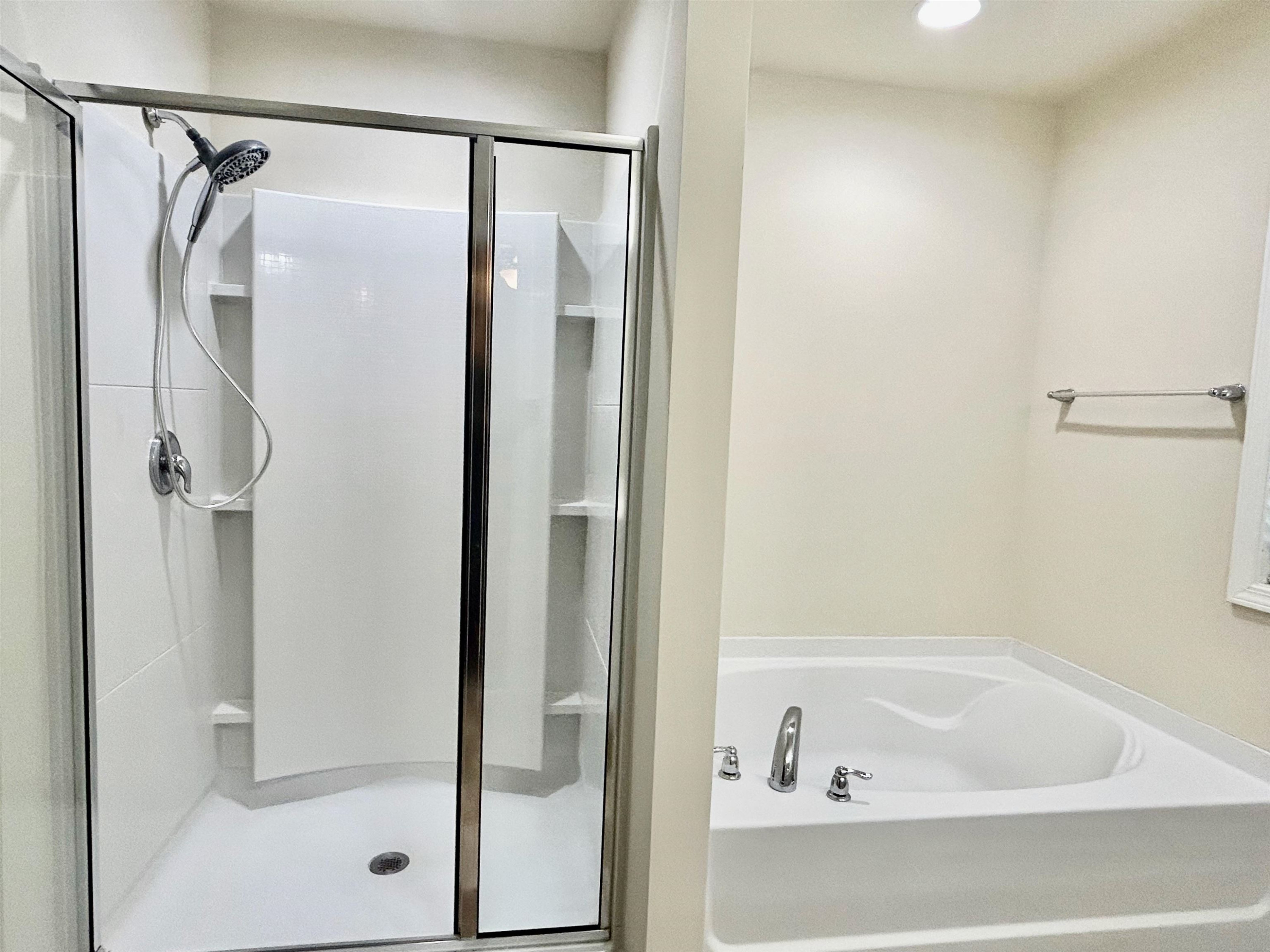 7804 Elmshire Way Raleigh, NC 27616 - Photo 29 of 41 a bathroom with a bathtub and a shower