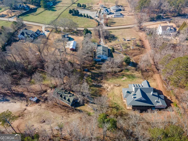 a aerial view of a house with a yard