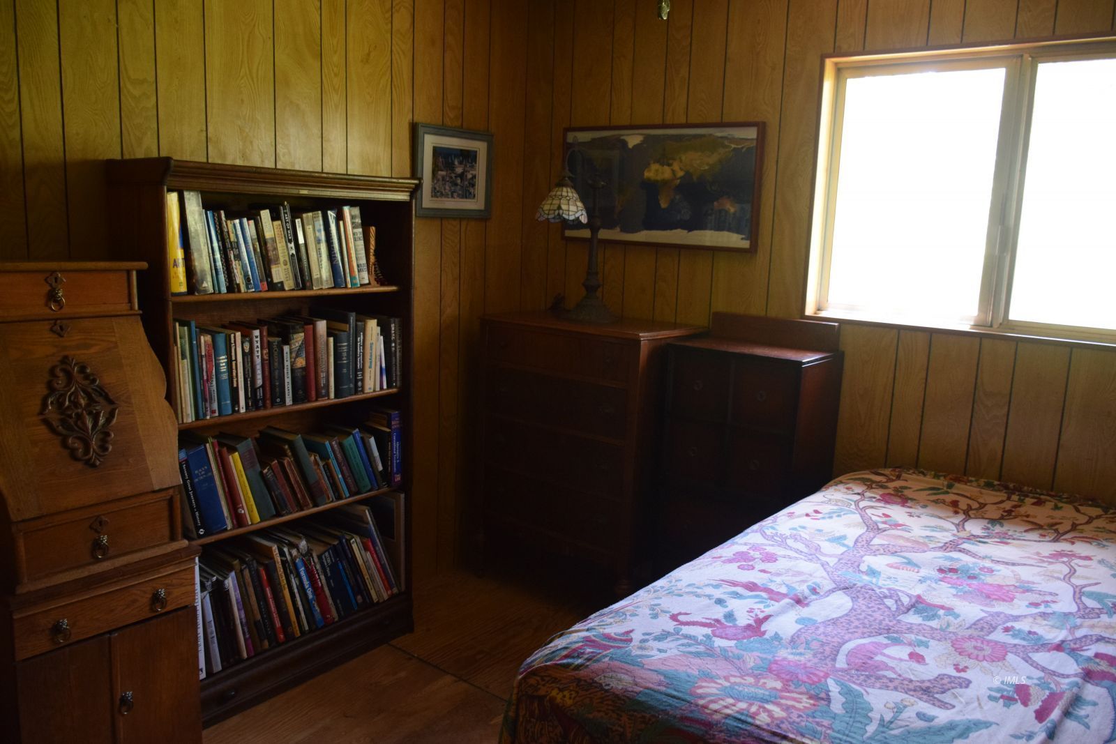 140 Iris Bishop, CA 93514 - Photo 14 of 19 a bedroom with a bed and a book shelf