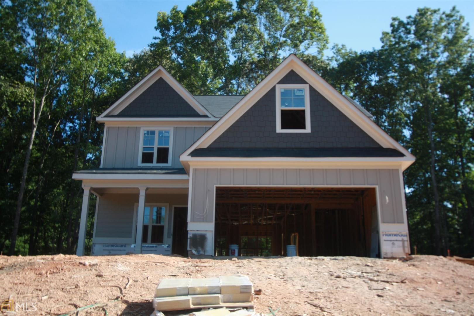 241 Ragan Drive, Unit 12 Dallas, GA 30157 - Photo 1 of 1 a front view of a house with a yard