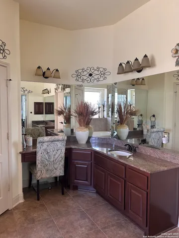 a kitchen with stainless steel appliances granite countertop a sink and a refrigerator