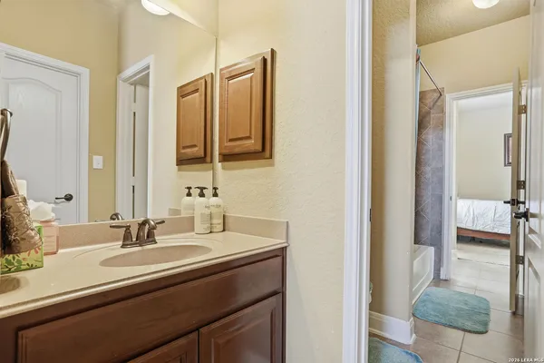 a bathroom with a sink and a mirror